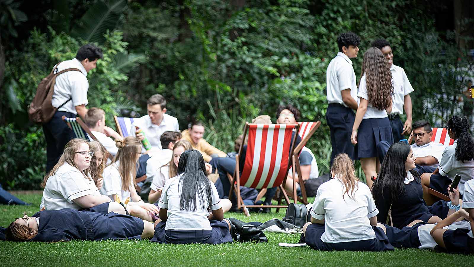 Students sitting on Duck Pond Lawn