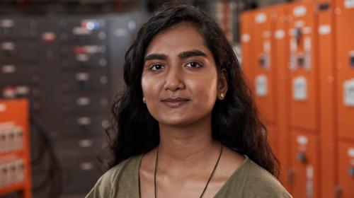 Engineering student Dipixa Sharma stands in a workshop