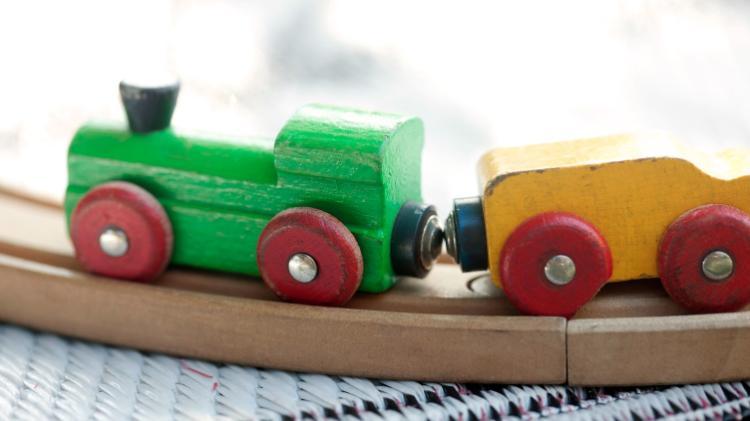 Image of a toy train set promoting Master of Autism at UOW