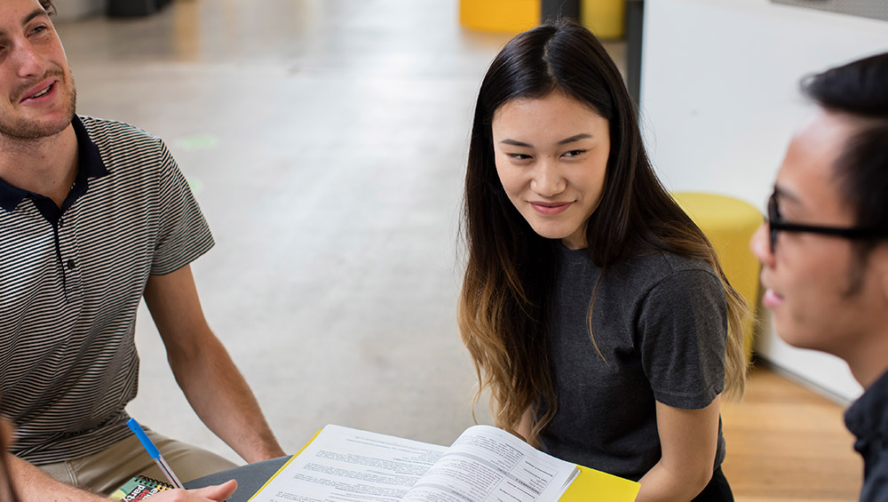 female international student in study group in building 11