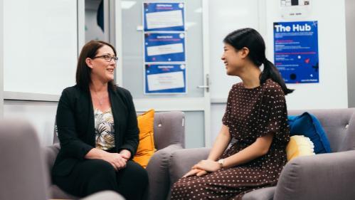 Image of a careers counsellor talking with a student