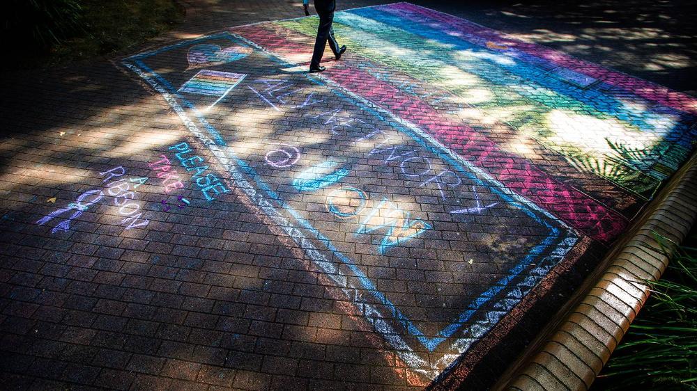 Rainbow chalk art on ground at UOW campus