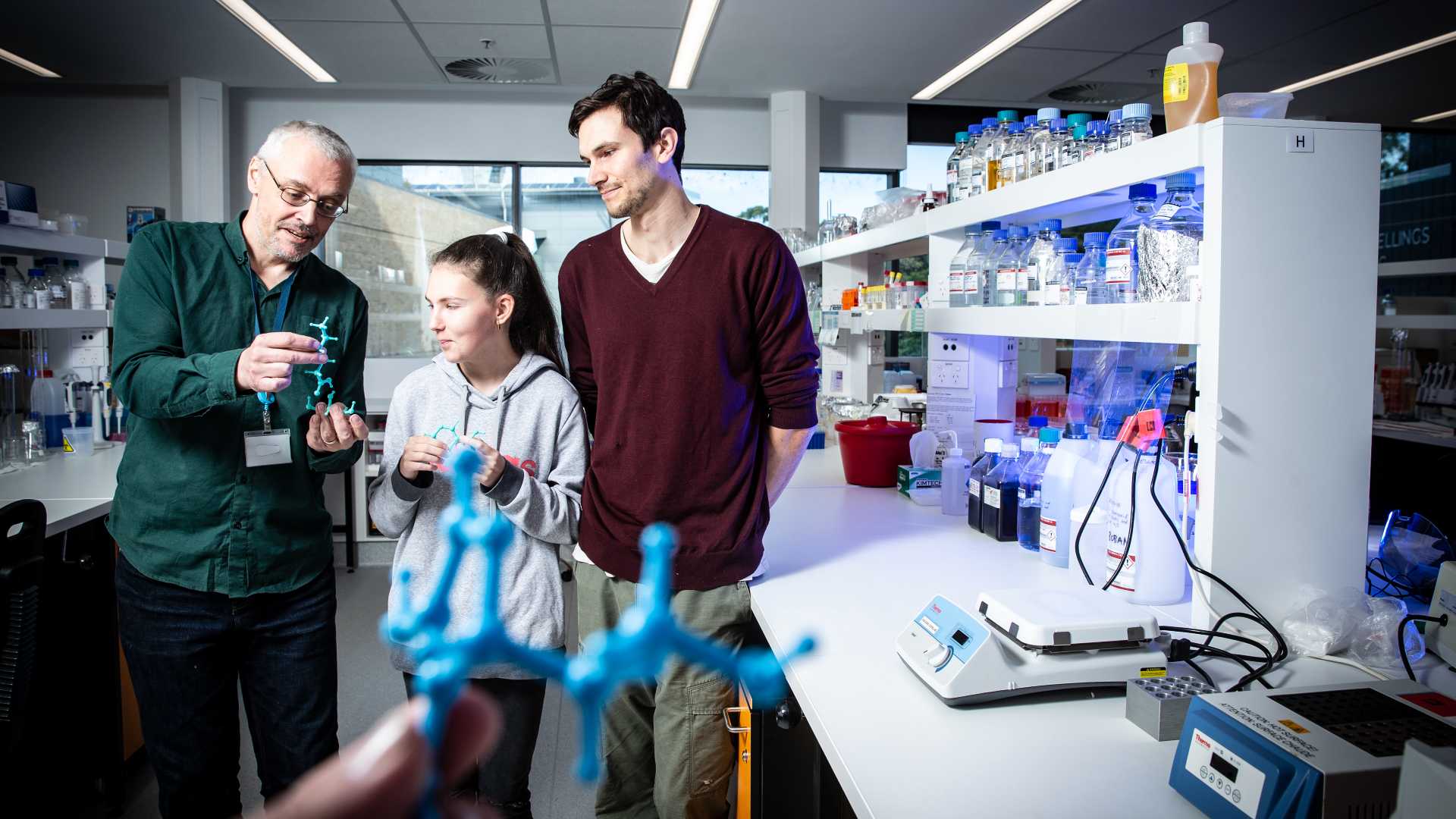 Aaron Oakley in lab with students at the University of Wollongong