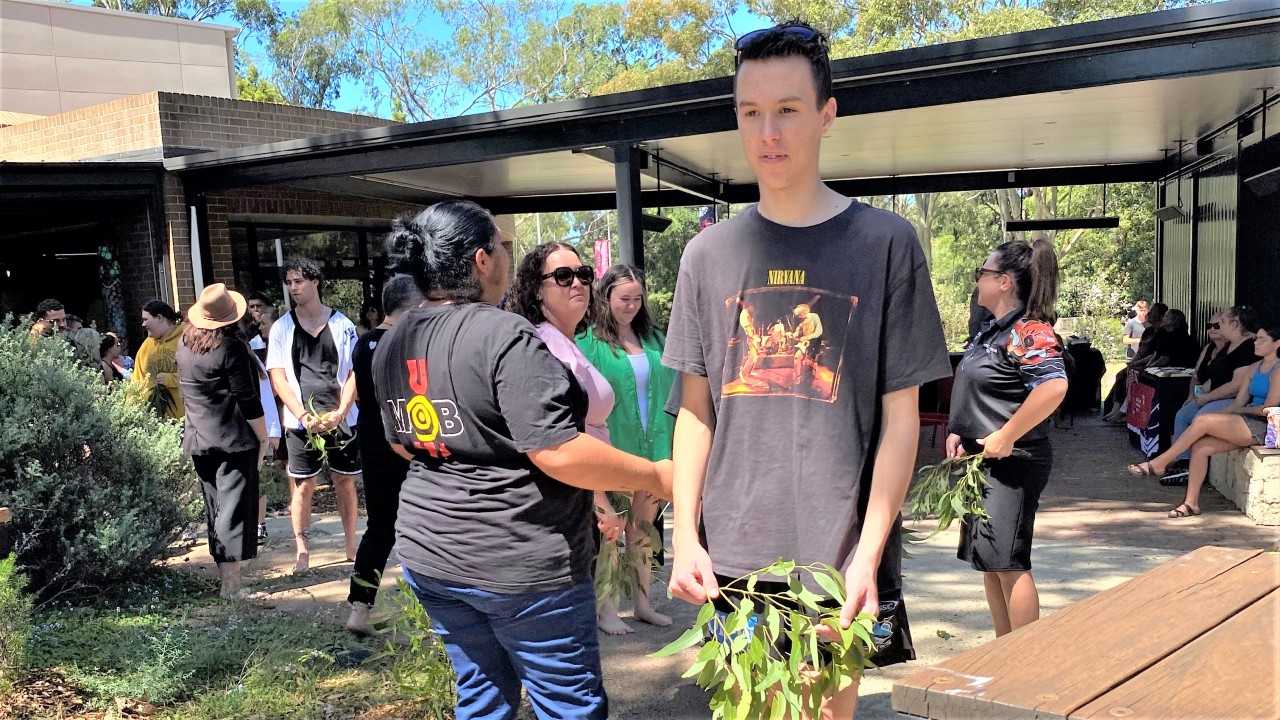Tallon Smith first year student getting cleansed during smoking ceremony