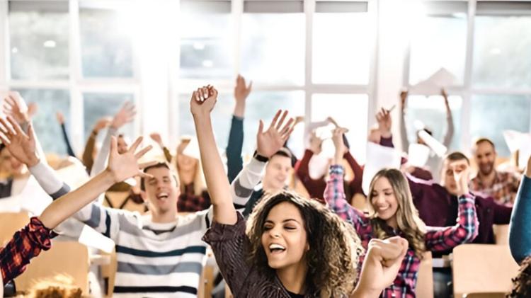 people raise their hands in celebration