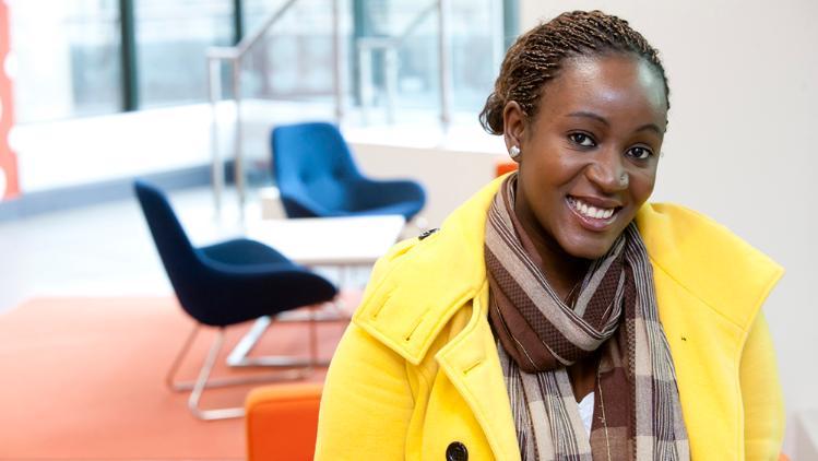 Girl wearing yellow jacket smiling 