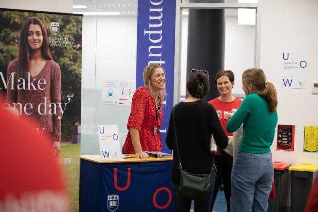 Future students talking with UOW staff