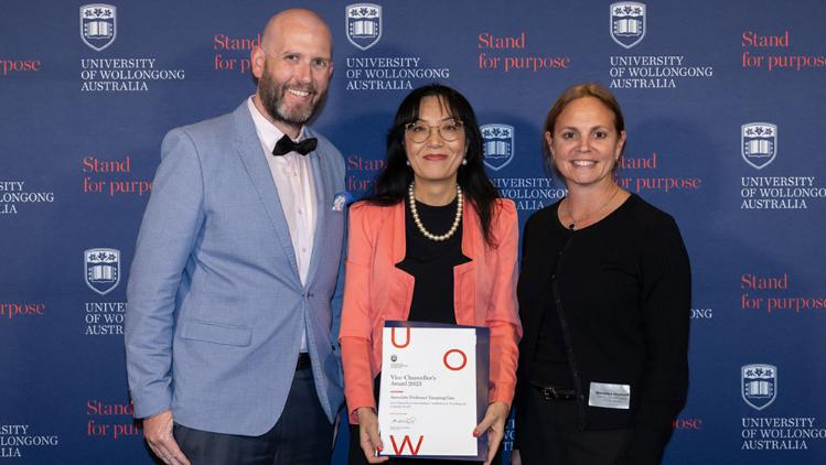 Staff member receives an award at UOW VC awards 2023