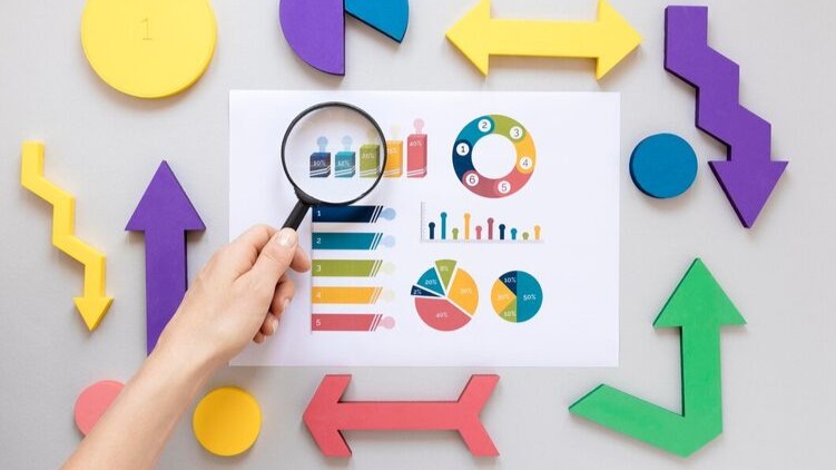 geometric shapes on a white background with a hand and magnifying glass on top