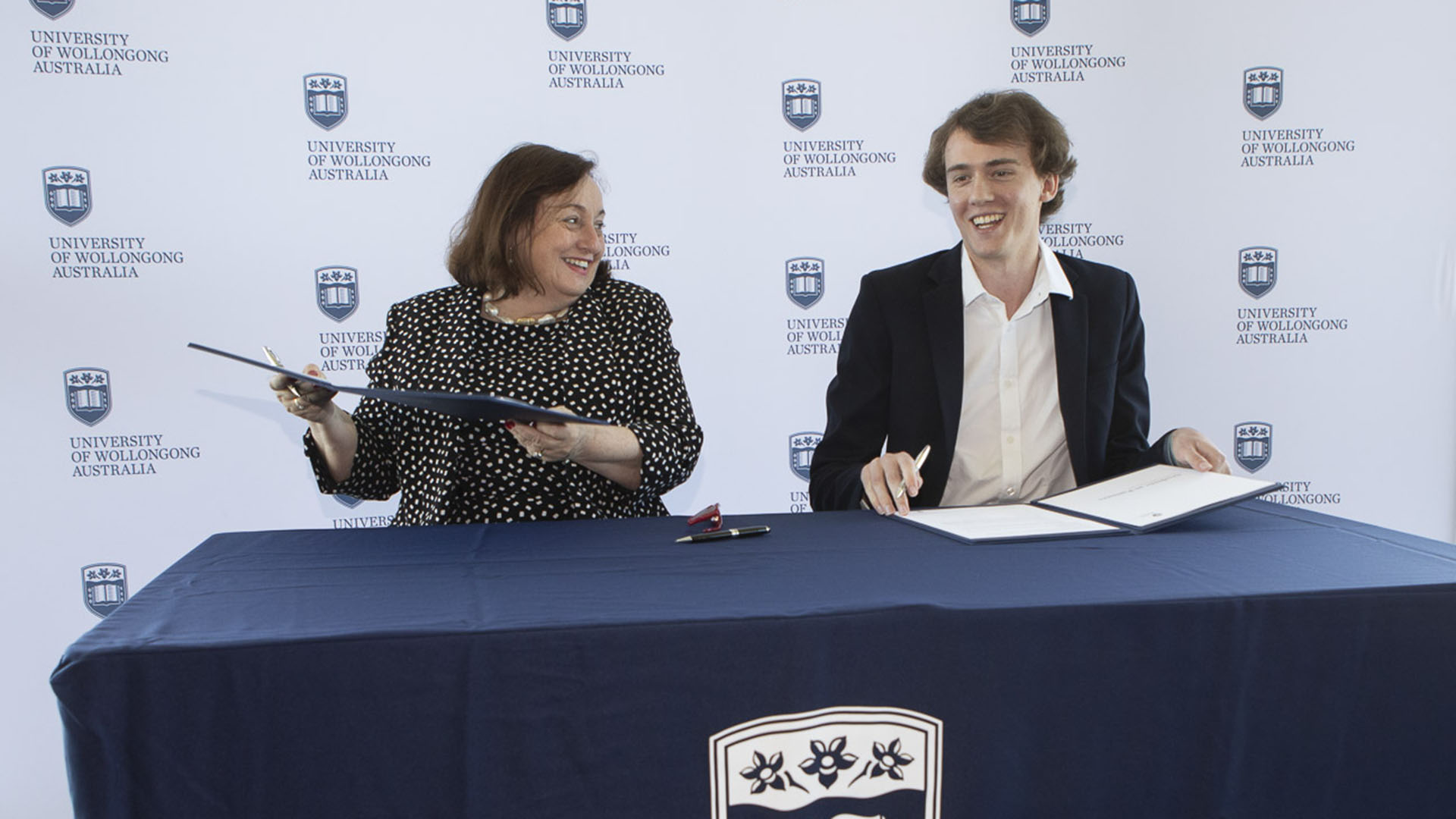 UOW Vice-Chancellor Patricia M. Davidson and Student Advisory Council Chair Jackson Cocks sign Students as Partners