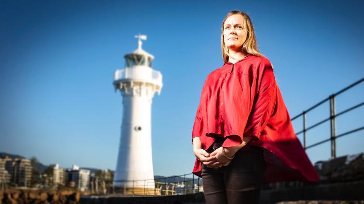 Marine science researcher Allison Broad near the lighthouse at Wollongong Harbour.