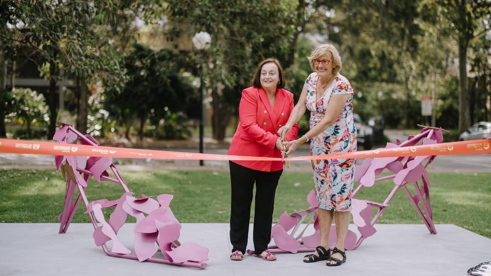 Professor Patricia M Davidson and sculptor Jenny Green cut the ribbon in front of the sculpture Beautopia. Photo: Michael Gray