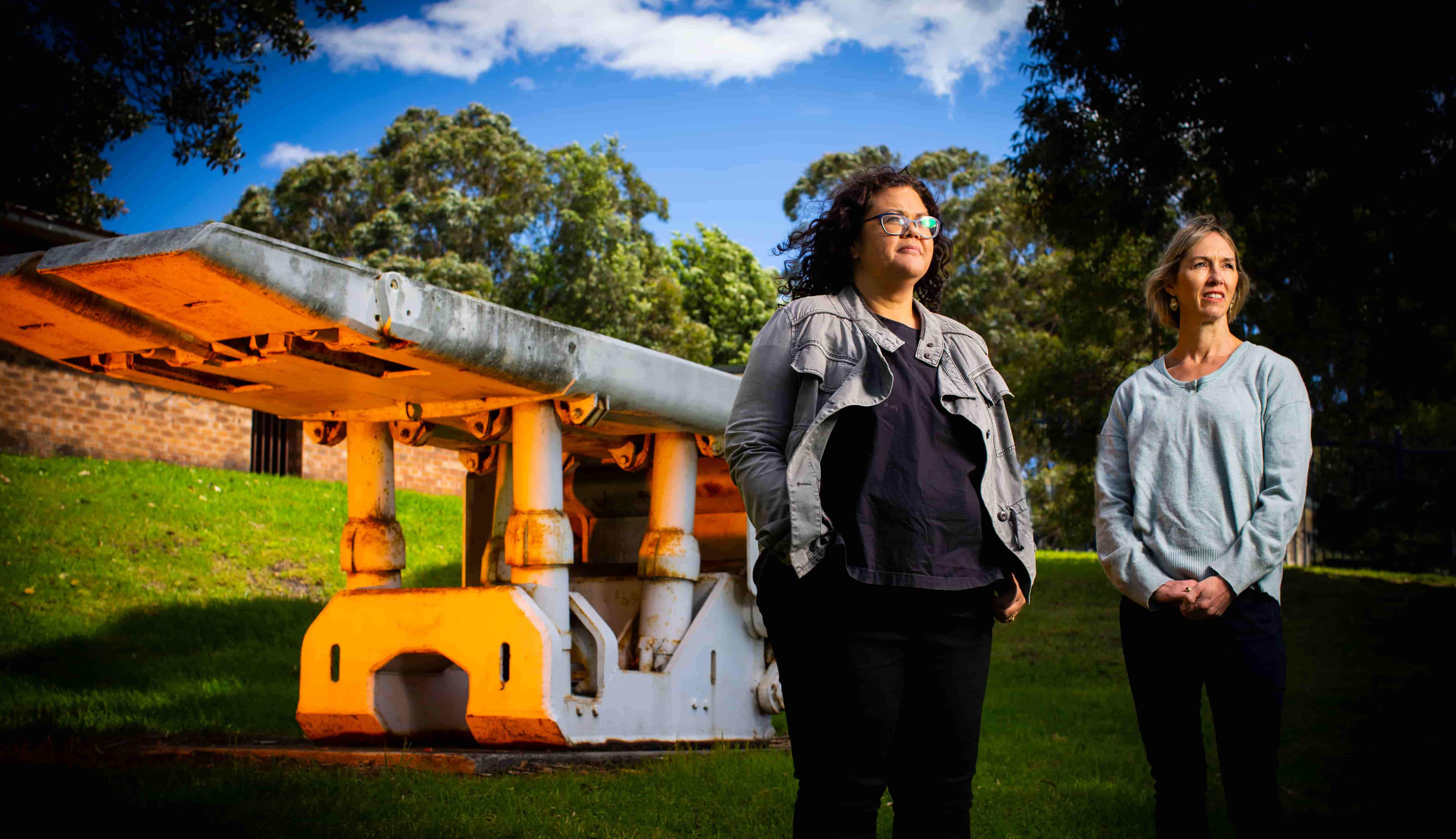 Dr Chantel Carr and Natasha Larkin stand in front of an statue in a park in Wollongong. Photo: Paul Jones