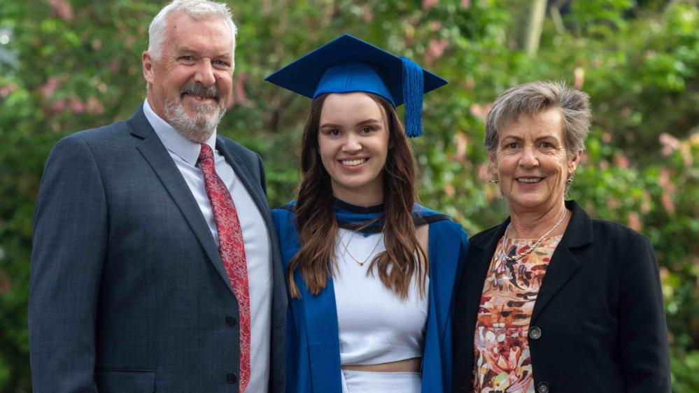 Ruby Evans, centre, with her father and her mother. Photo: Andy Zakeli