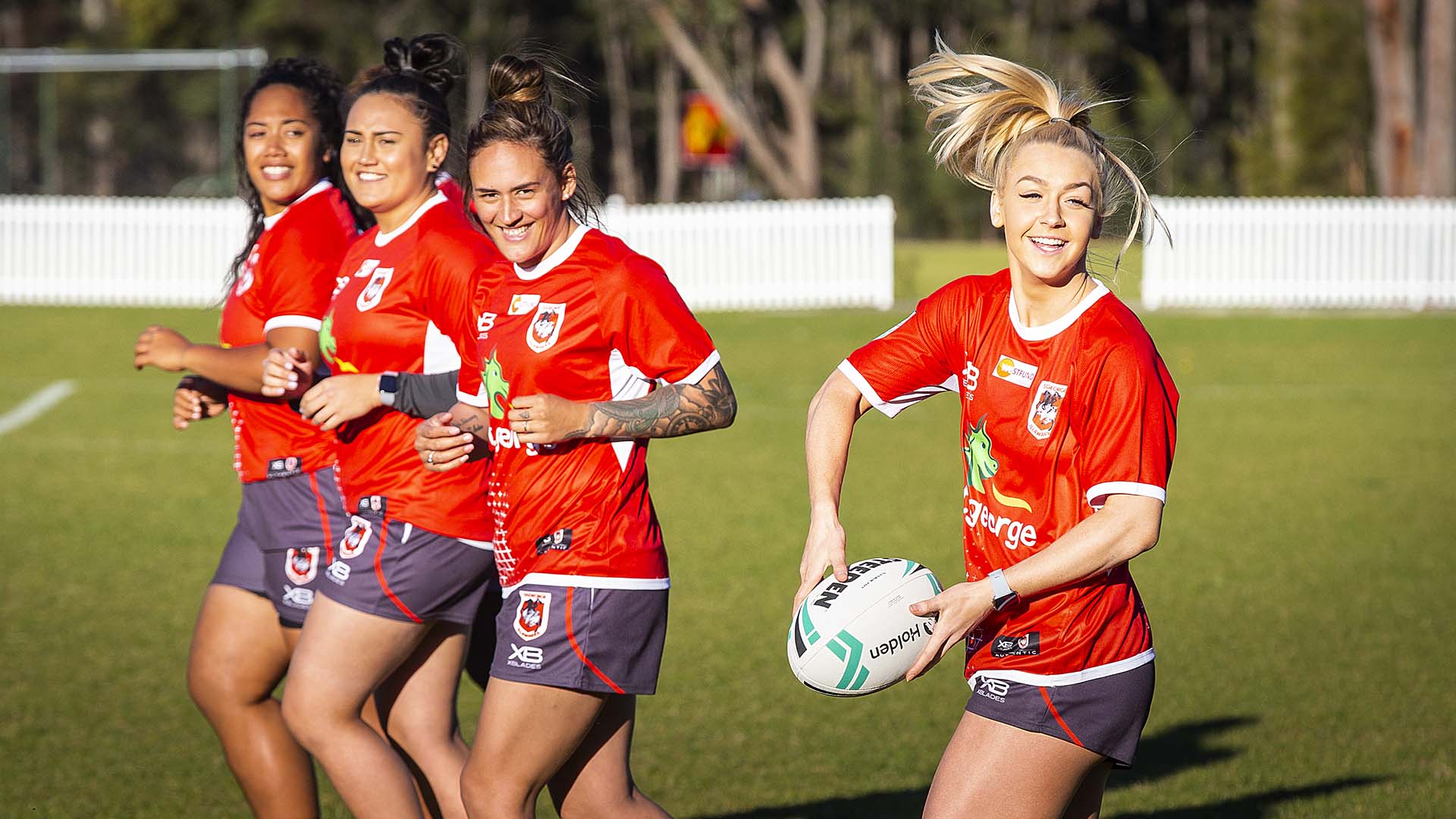 Players from the St George Illawarra Dragons women's team training on one of UOW's ovals.