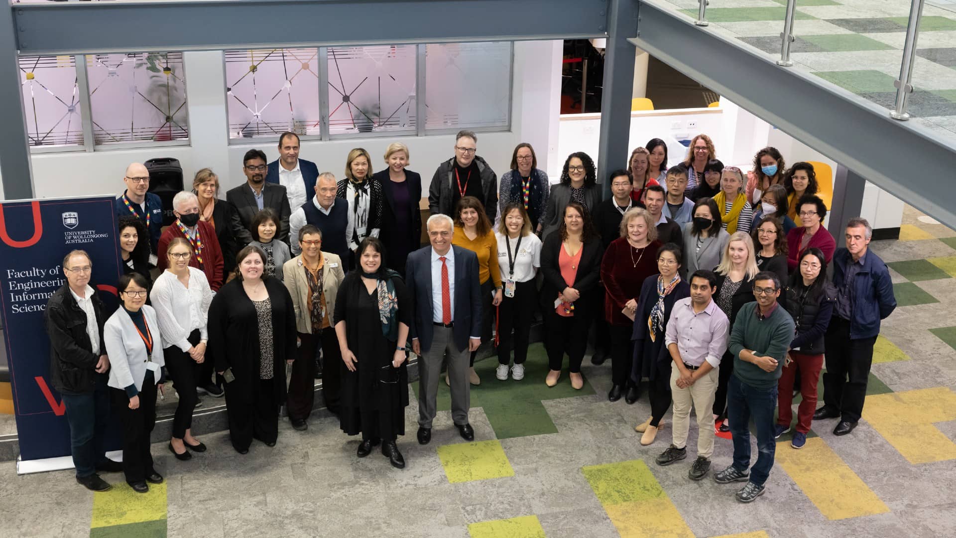Team members from the Faculty of Engineering and Information Sciences attend the launch of the diversity initiative. They are all smiling. Photo: Mark Newsham