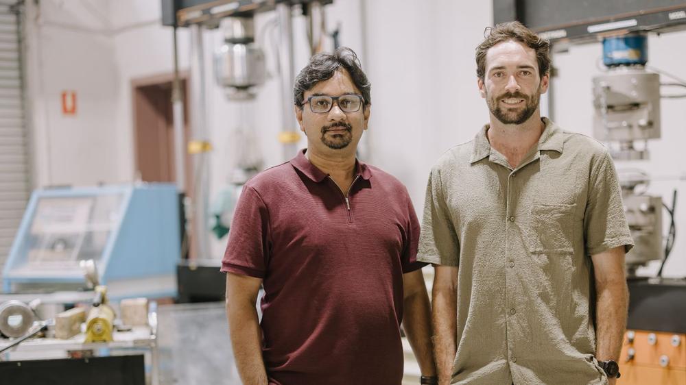 Professor Faisal Hai and Michael Staplevan standing in front of lab equipment in UOW’s Strategic Water Infrastructure Lab. Photo: Michael Gray