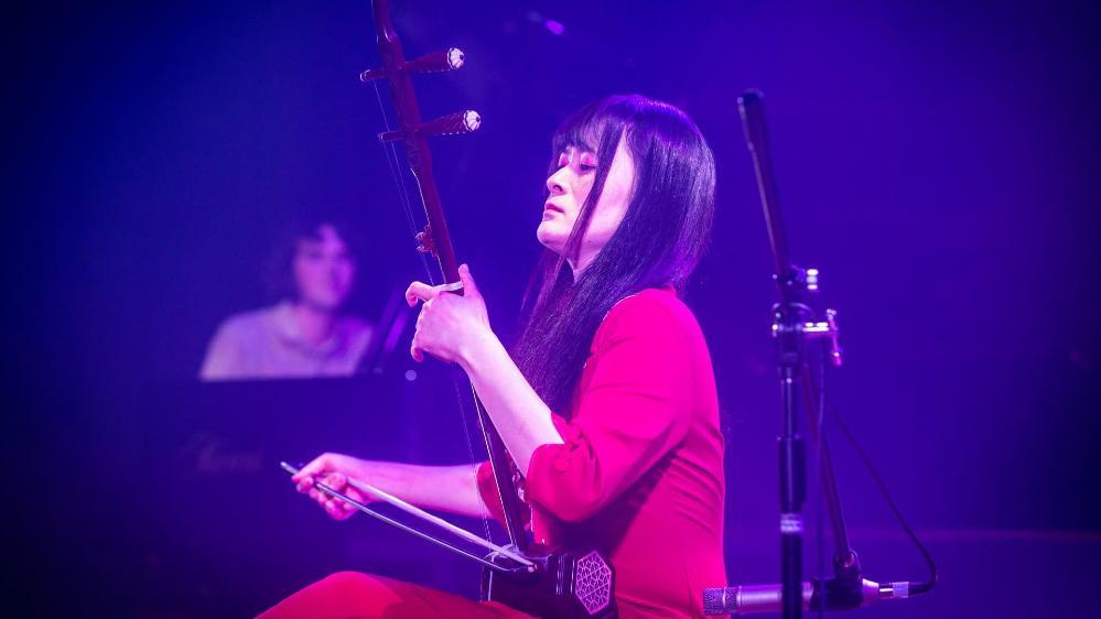 A student performs on stage during the UOW graduate music show, Triple Fret. Photo: Paul Jones