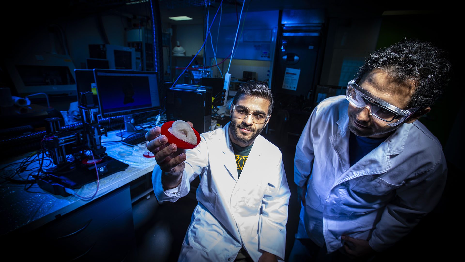 IPRI researchers Sepehr Talebian and Dr Sepidar Sayyar with a silicon ear made by a 3D Genii bioprinter at UOW’s Translational Research Initiative for Cellular Engineering and Printing (TRICEP)