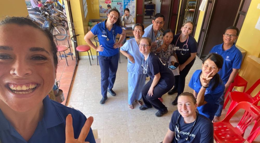 Loureene Kelly in a selfie with a group of nurses in Cambodia. Loureene is in the foreground taking the photo.