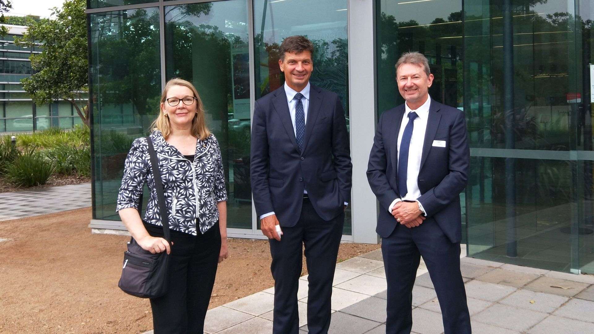 UOW Deputy Vice-Chancellor (Research and Innovation) Professor Jennifer L Martin AC, Federal Minister for Industry, Energy and Emissions Reduction the Honourable Angus Taylor and UOW Energy Futures Network Director Mr Ty Christopher, standing out the front of the AIIM building, Innovation Campus