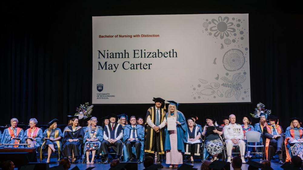 Niamh Carter on stage at graduation. Photo: Michael Gray