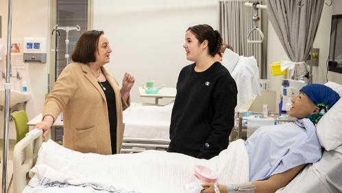 UOW Vice-Chancellor Professor Patricia Davidson talks to nursing student Emily Heyho at UOW Sutherland.