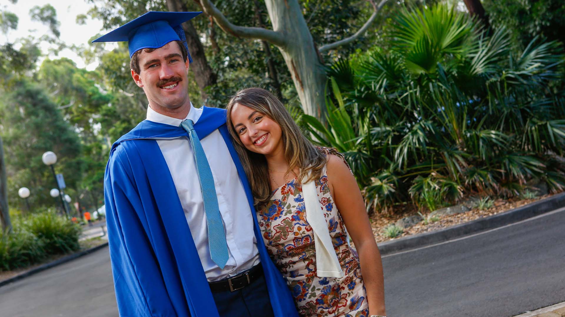 UOW graduate Seamus King poses with his girlfriend