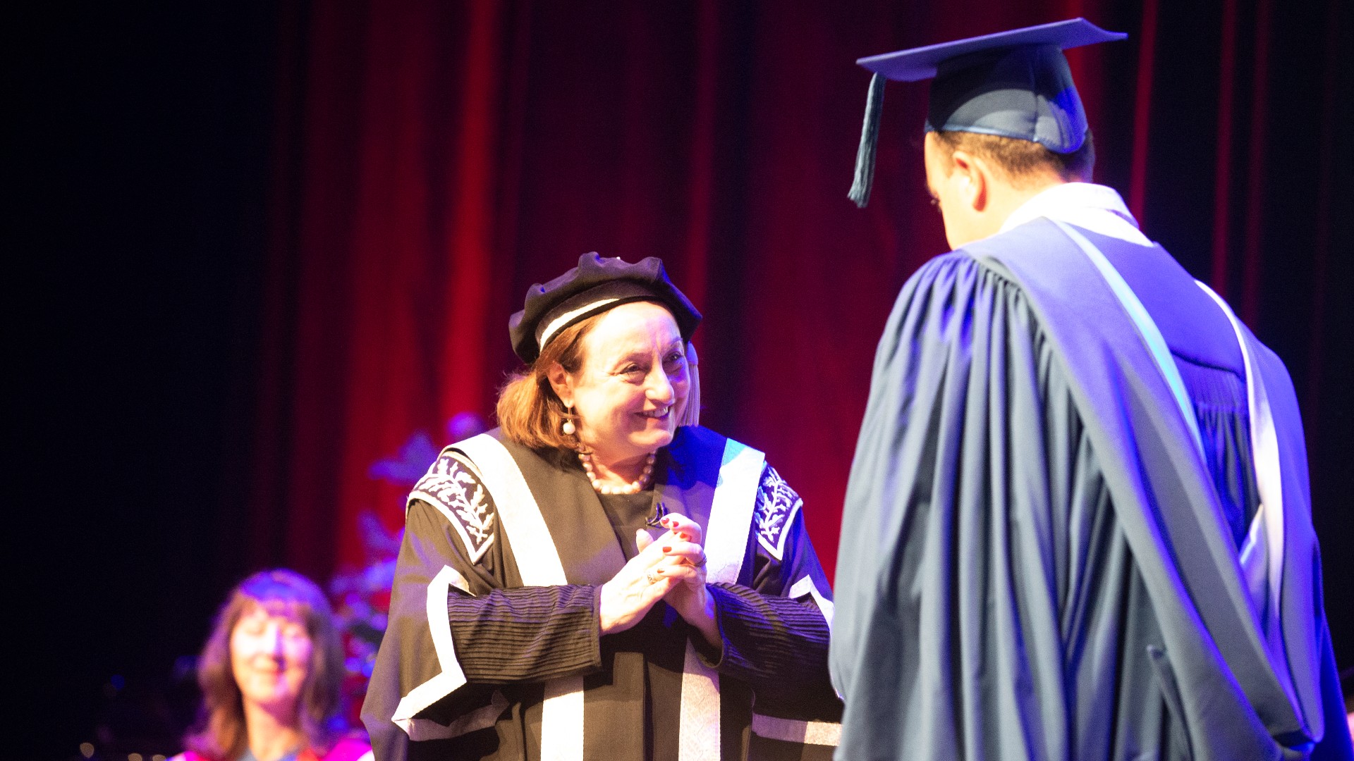 Vice Chancellor Professor Patricia Davidson greets a student on stage at the Shoalhaven graduation ceremonies. Photo: Paul Jones