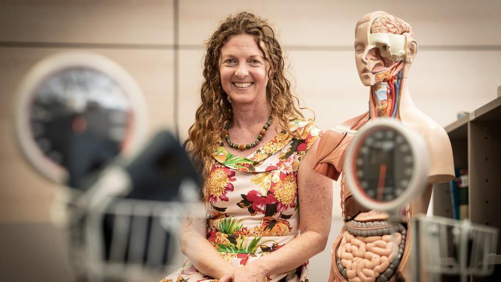 Dr Theresa Larkin is pictured with a body model used in her medical science classes. Photo: Paul Jones