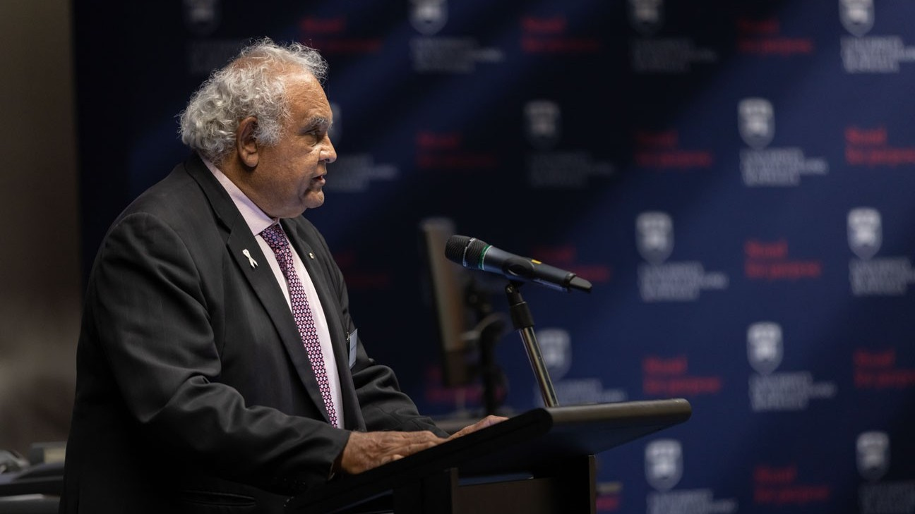 Professor Tom Calma stands at a lectern delivering the Goldring Lecture. Photo: Mark Newsham