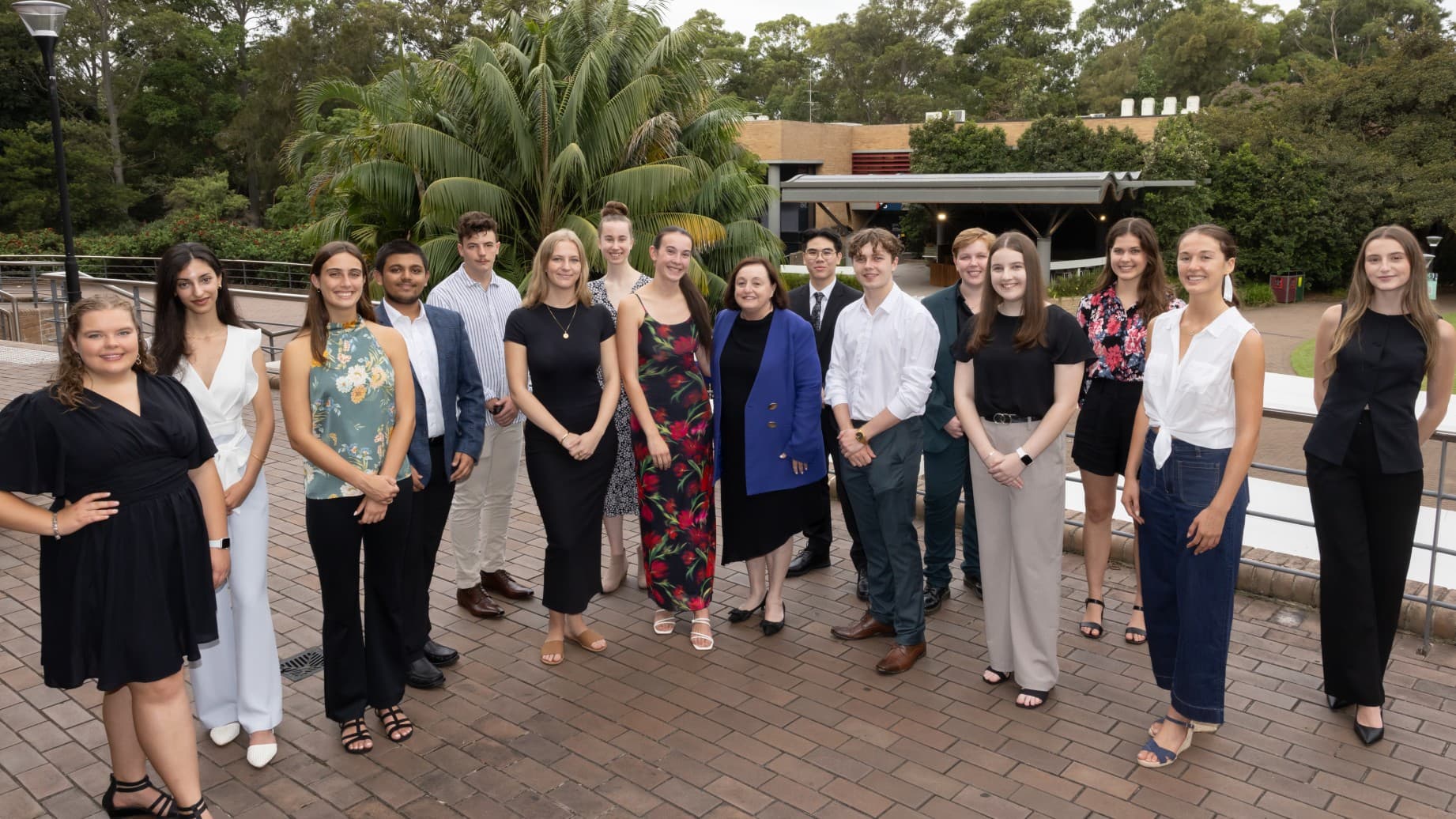 The group of Vice Chancellor's Leadership Scholars stand on the balcony of a building at the UNiversity of Wollongong with Professor Patricia Davidson. Photo: Mark Newsham