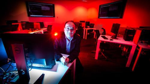 World-renowned expert in cyber security and cryptography expert Distinguished Professor Willy Susilo in an IT lab at UOW.