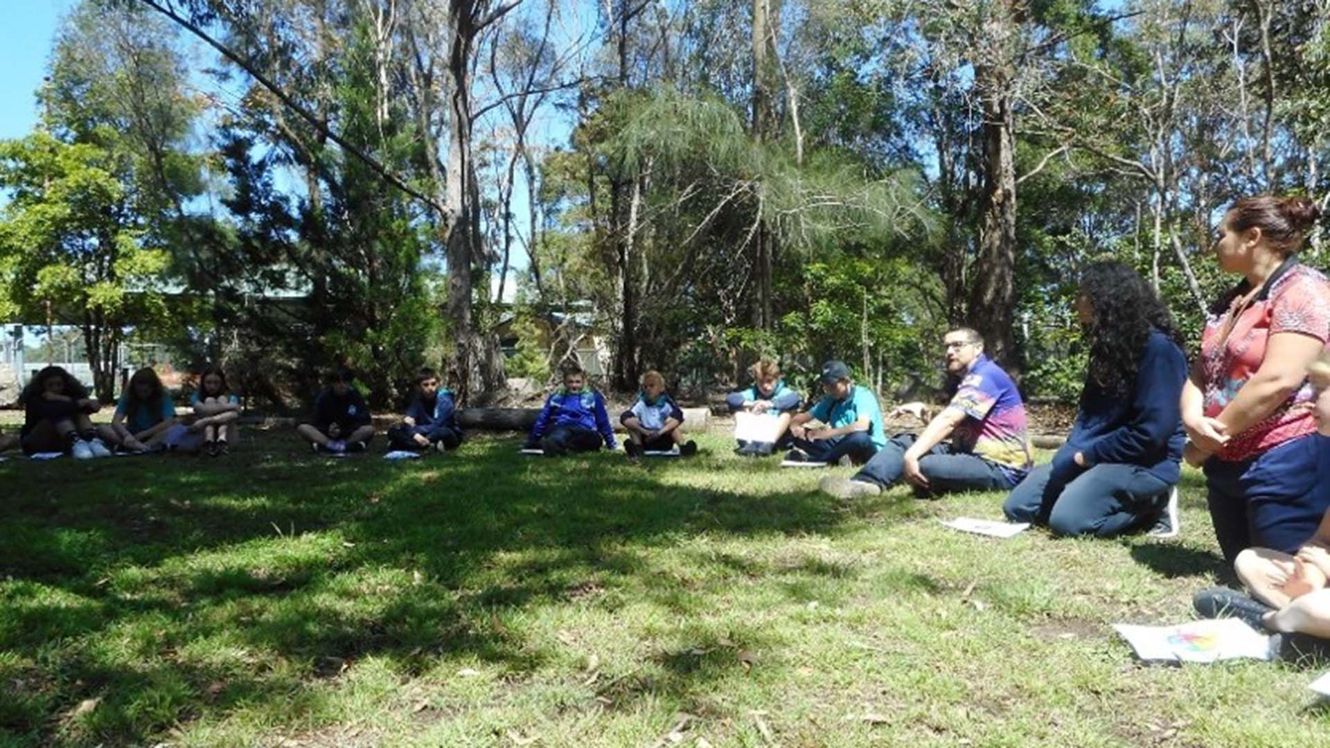 Yarning circle with UOW Outreach staff and school students