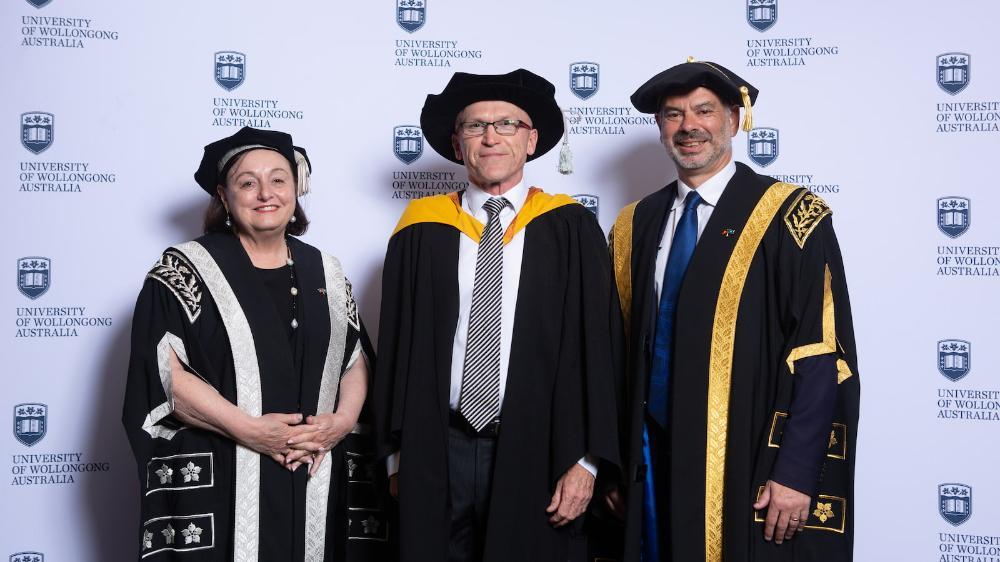 Professor Paul Cooper, centre, with Vice-Chancellor Professor Patricia M Davidson and Deputy Chancellor Warwick Shanks. Photo: Andy Zakeli