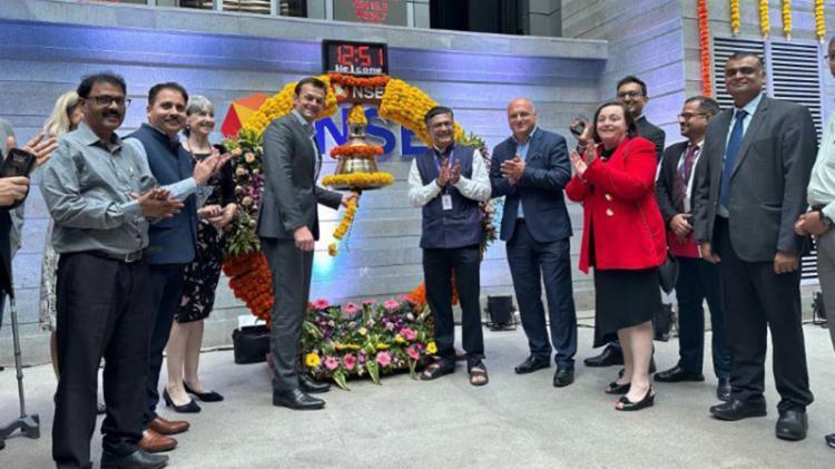 UOW Global Brand Ambassador Adam Gilchrist ringing the ceremonial bell at NSE India