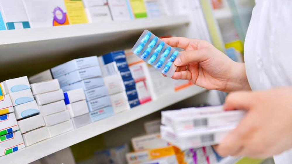 Generic pic of pharmacist with antibiotic pills
