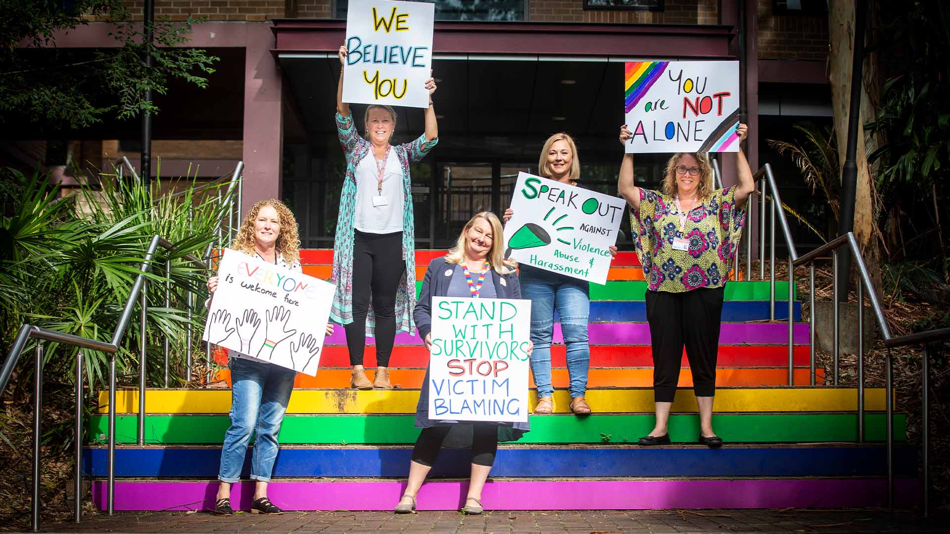 Respect Week SARC team on rainbow stairs