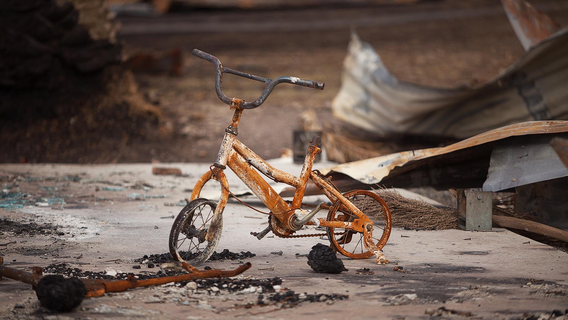Children's bike on a bushfire burnt property