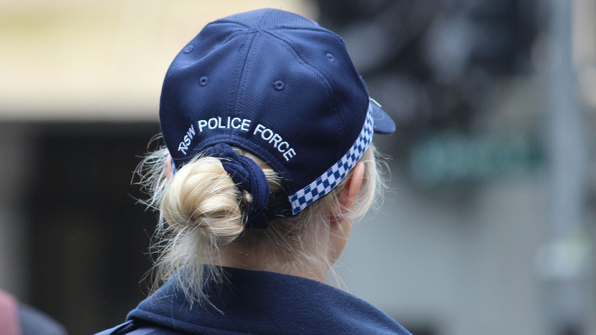 A female NSW police officer, photographed from behind