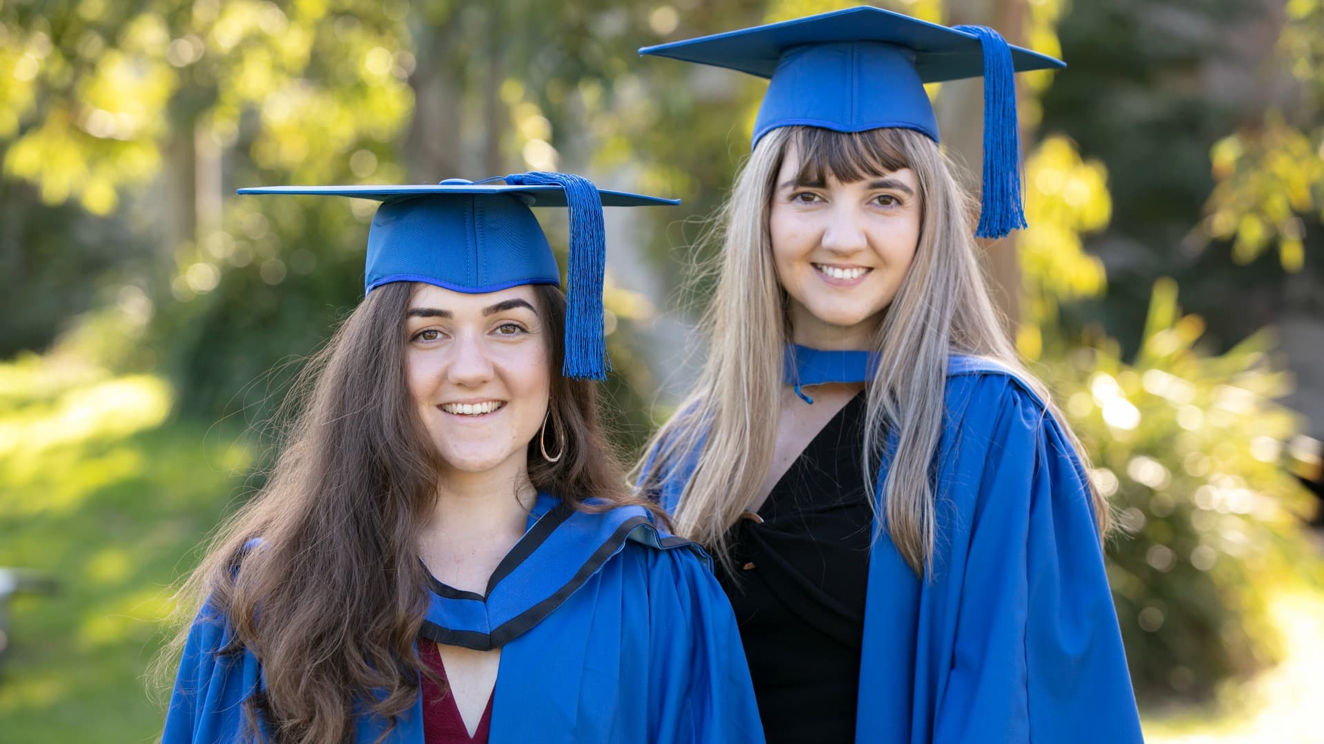Brenna and Bronte Petrolo, pictured in their graduation gowns. Photo: Mark Newsham
