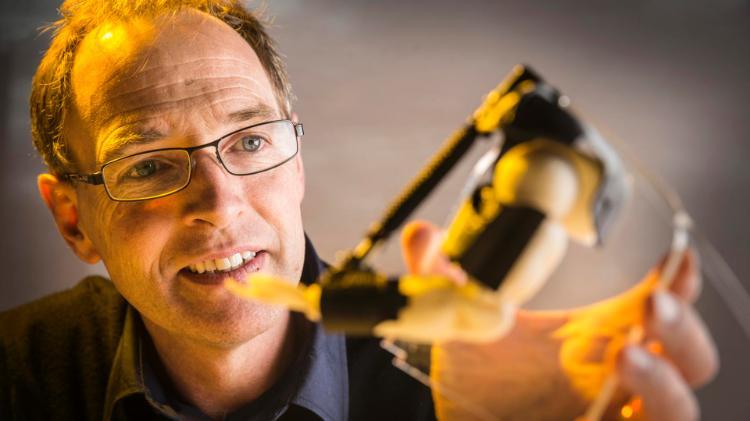 Senior Professor Geoffrey Spinks demonstrates the artificial muscles