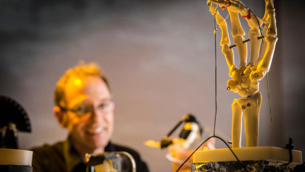 Senior Professor Geoff Spinks, from the Australian Institute for Innovative Materials, with an example of an artificial muscle.