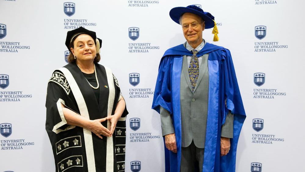 Emeritus Professor Richard Kenchington, pictured wearing his graduation gown and cap, with Vice Chancellor Professor Patricia M Davidson.. Photo: Paul Jones