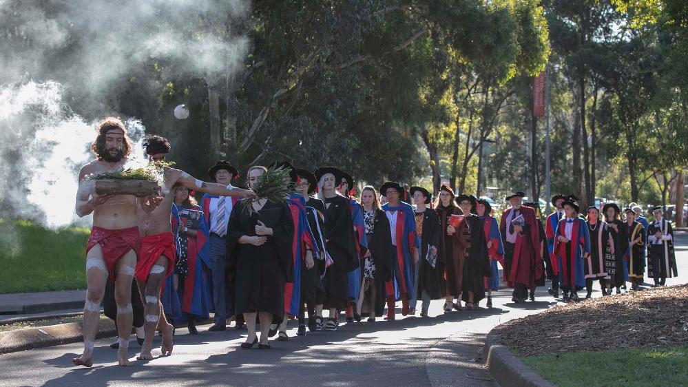 The academic procession makes it's way to the graduation ceremony.