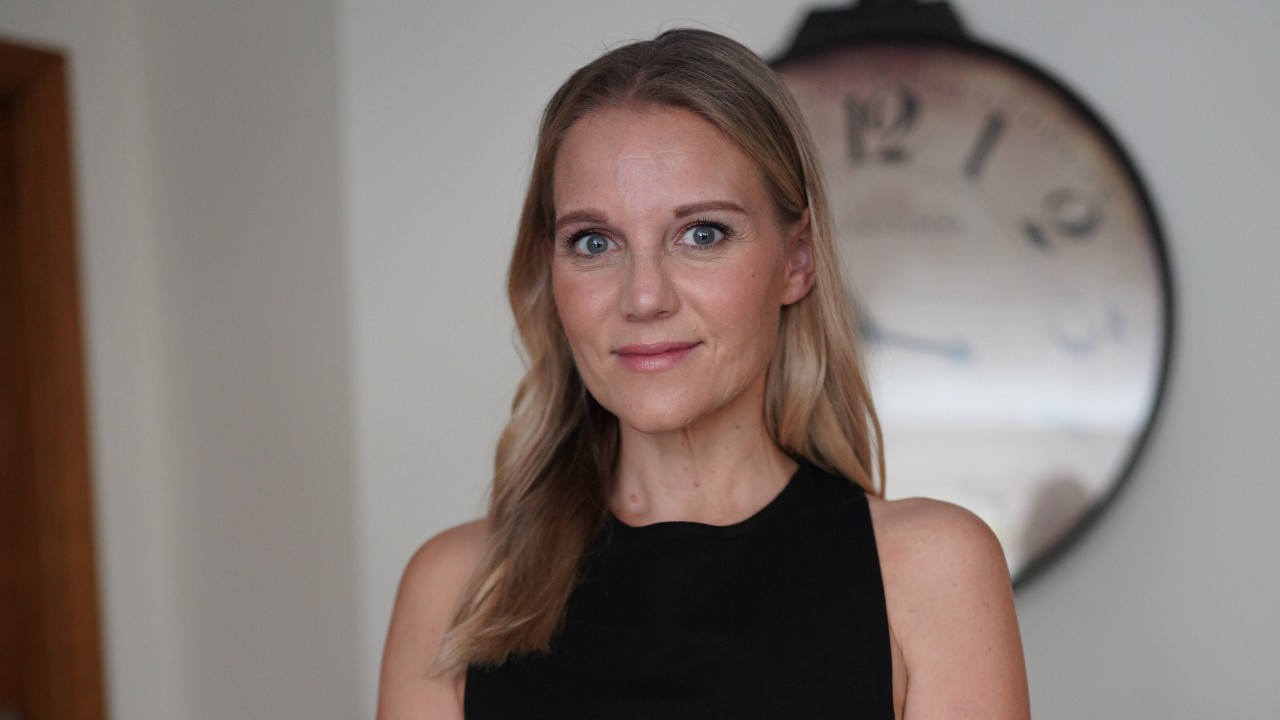 Alumni Award winner Jessica Smith. She is smiling at the camera and wearing a black top. Photo: Supplied