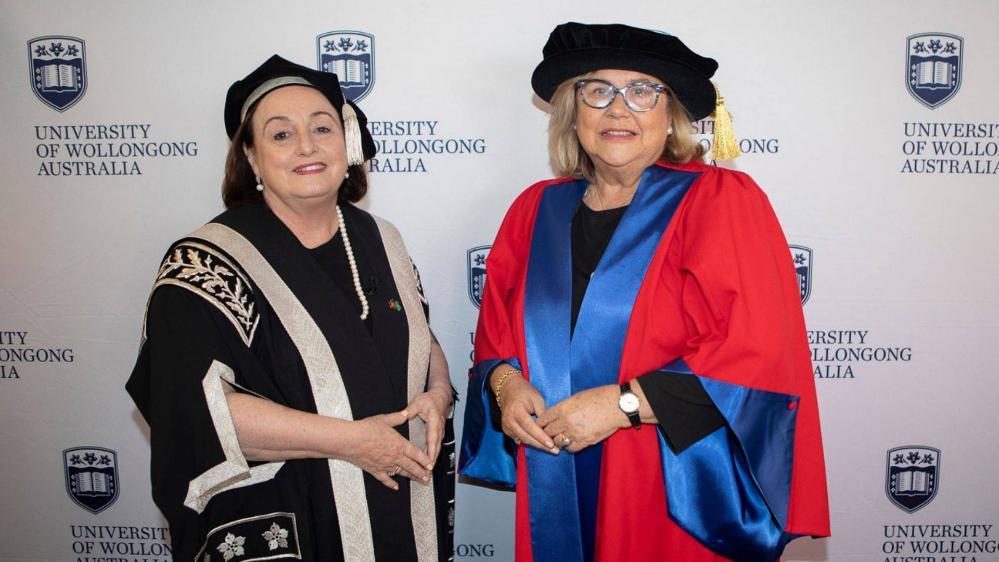 Vice-Chancellor Patricia M Davidson and Kim McKay pictured against a UOW wall. Photo: Mark Newsham