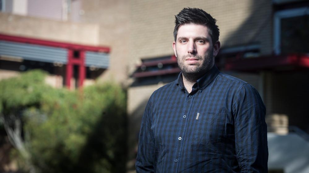 An image of Dr Stewart Vella standing in front of a building. Photo: Paul Jones