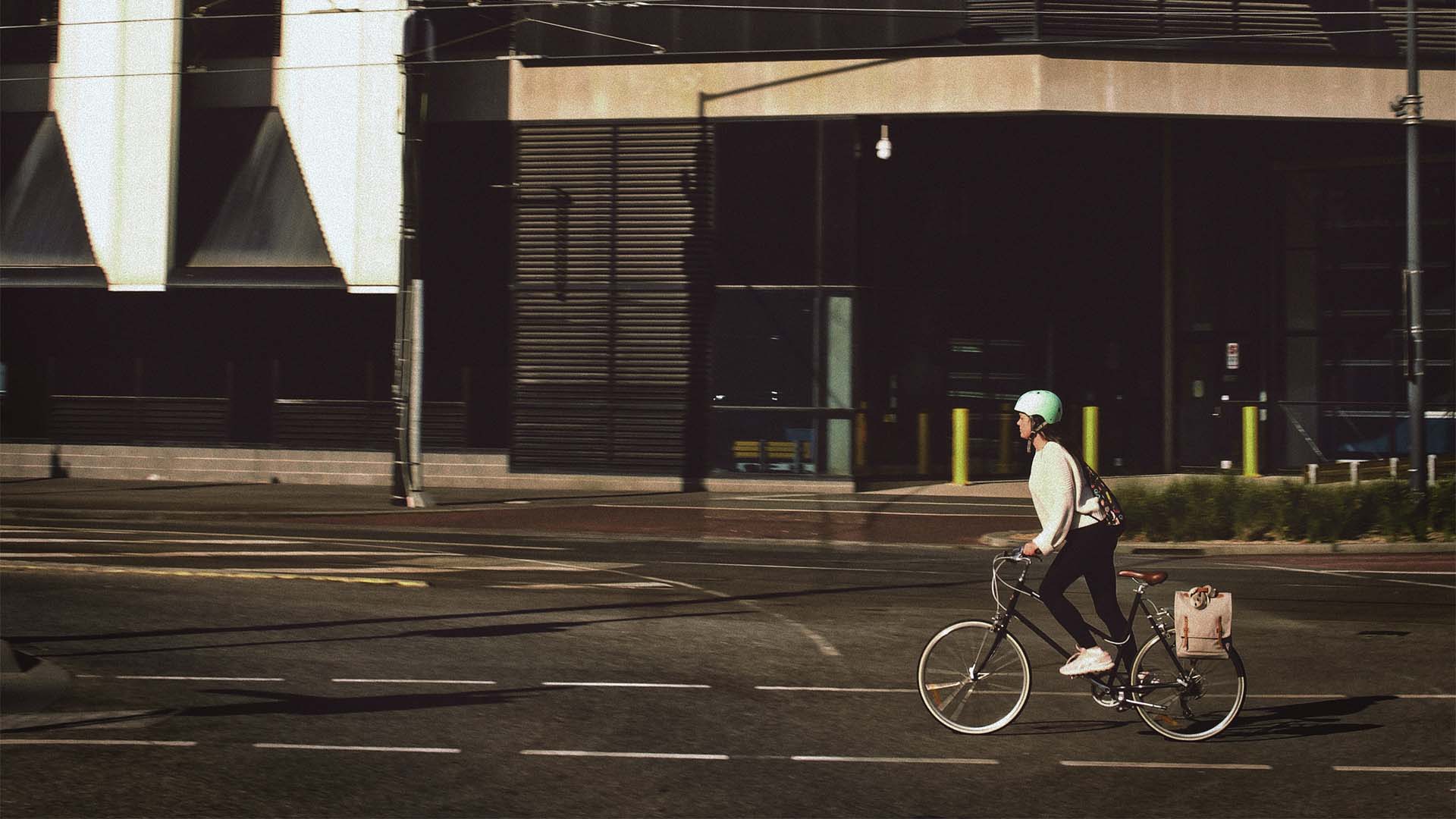 A woman cycling in Australian city